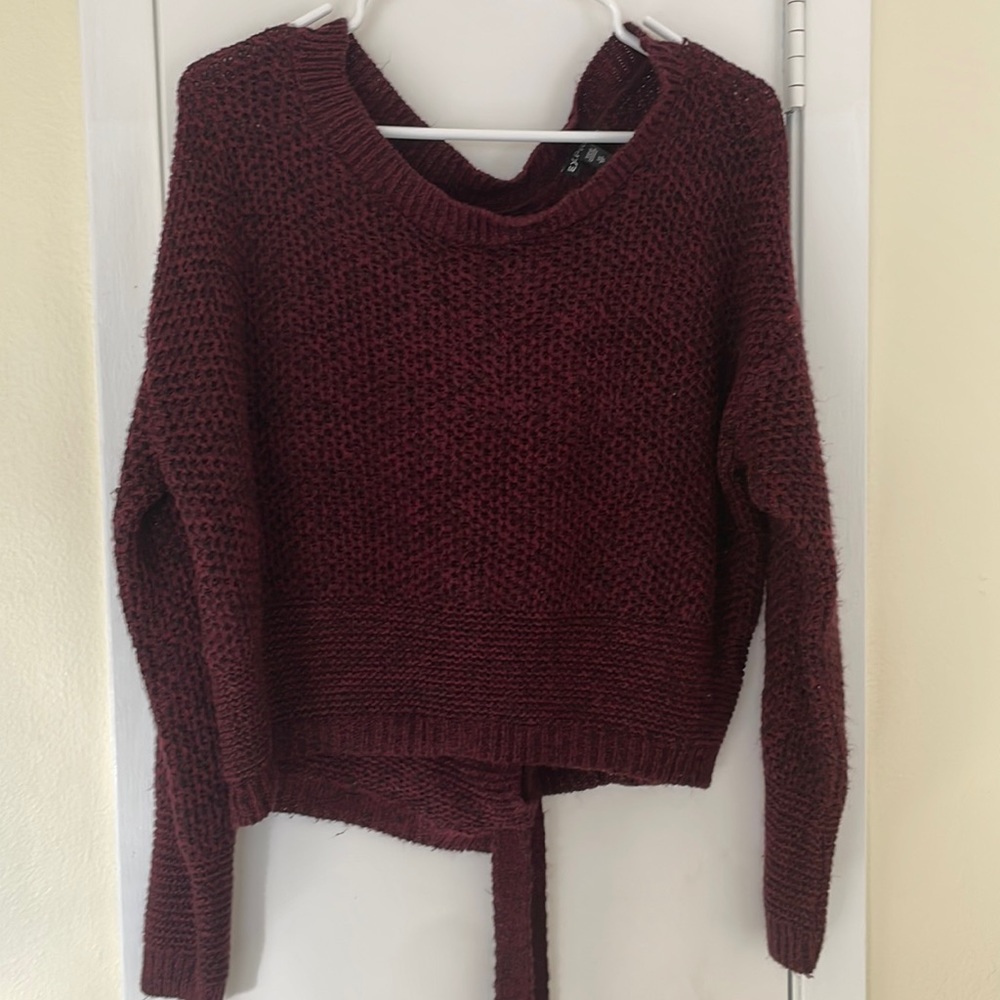 Burgundy Express crop sweater with lace-up bow on the back, size XS.